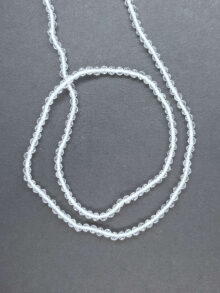 Bergkristal +/-2,6mm facet streng  kralen 32×2,6×2,6mm prijs per streng
